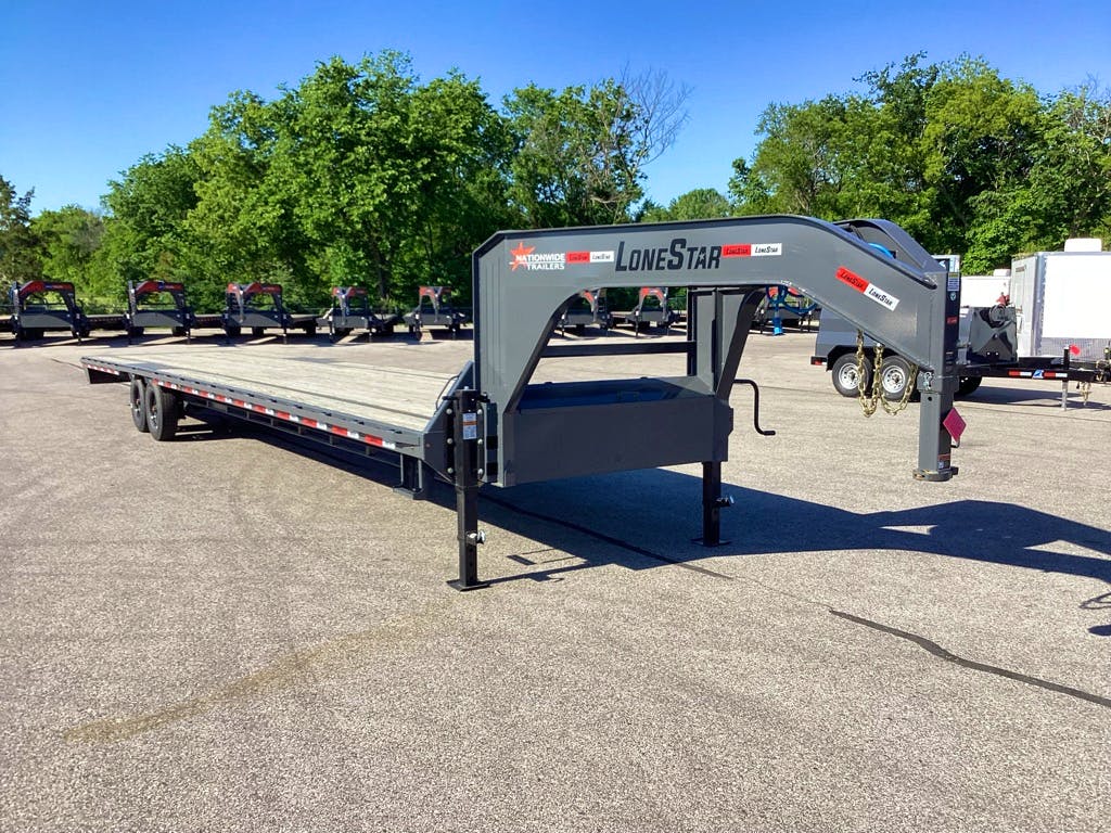 LoneStar 40'x102" Gooseneck Lo-Pro Flatbed Trailer w/ Singles (LS) - Stock #75422 - Image 1 of 3