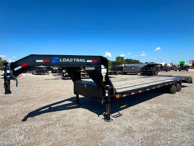 Load Trail USED 30'x102" Flatbed Trailer w/ 5ft Dovetail & Mega Ramps - Image 2