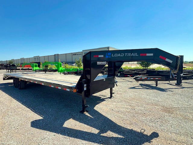 Load Trail USED 30'x102" Flatbed Trailer w/ 5ft Dovetail & Mega Ramps - Image 1