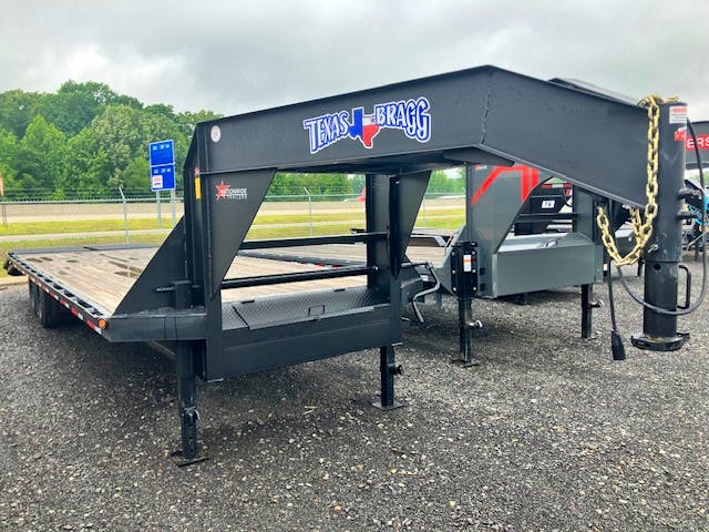 Texas Bragg 28'X102" Gooseneck Flatbed Trailer w/ 5' Dovetail - Stock #85369 - Image 1 of 9