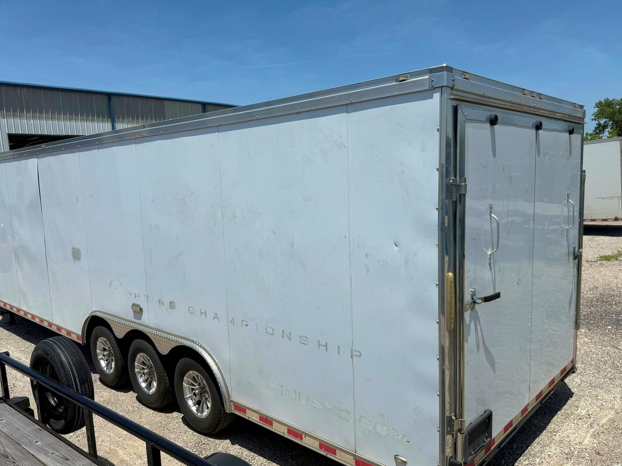Cargo Mate USED 8.5'x34' Triple Axle Gooseneck Enclosed Cargo Trailer