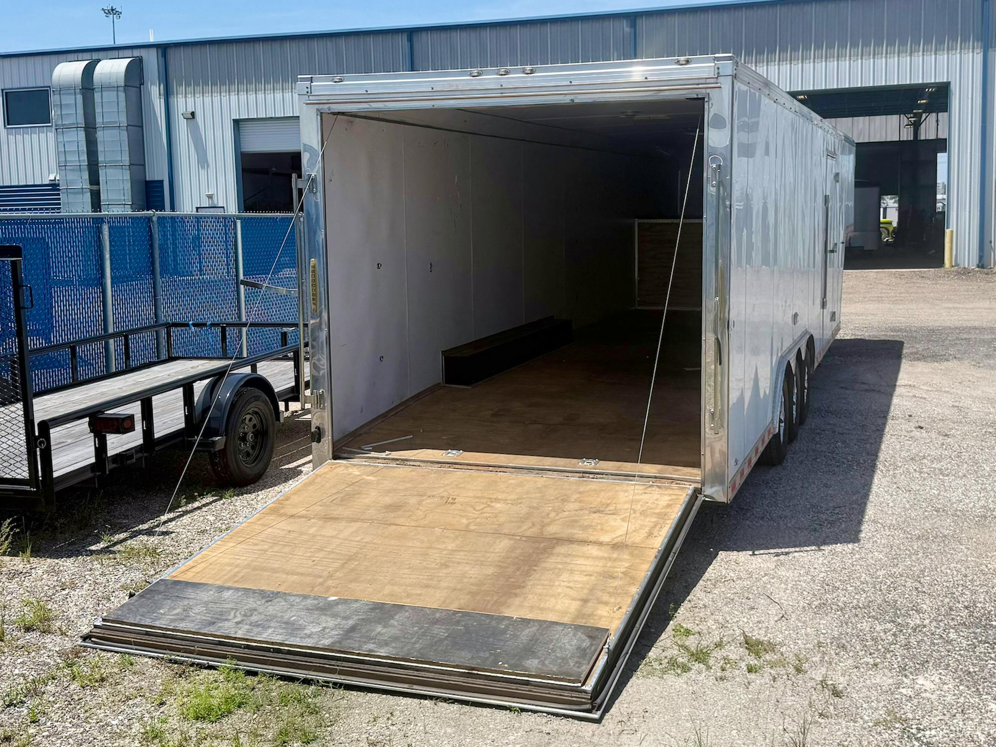 Cargo Mate USED 8.5'x34' Triple Axle Gooseneck Enclosed Cargo Trailer