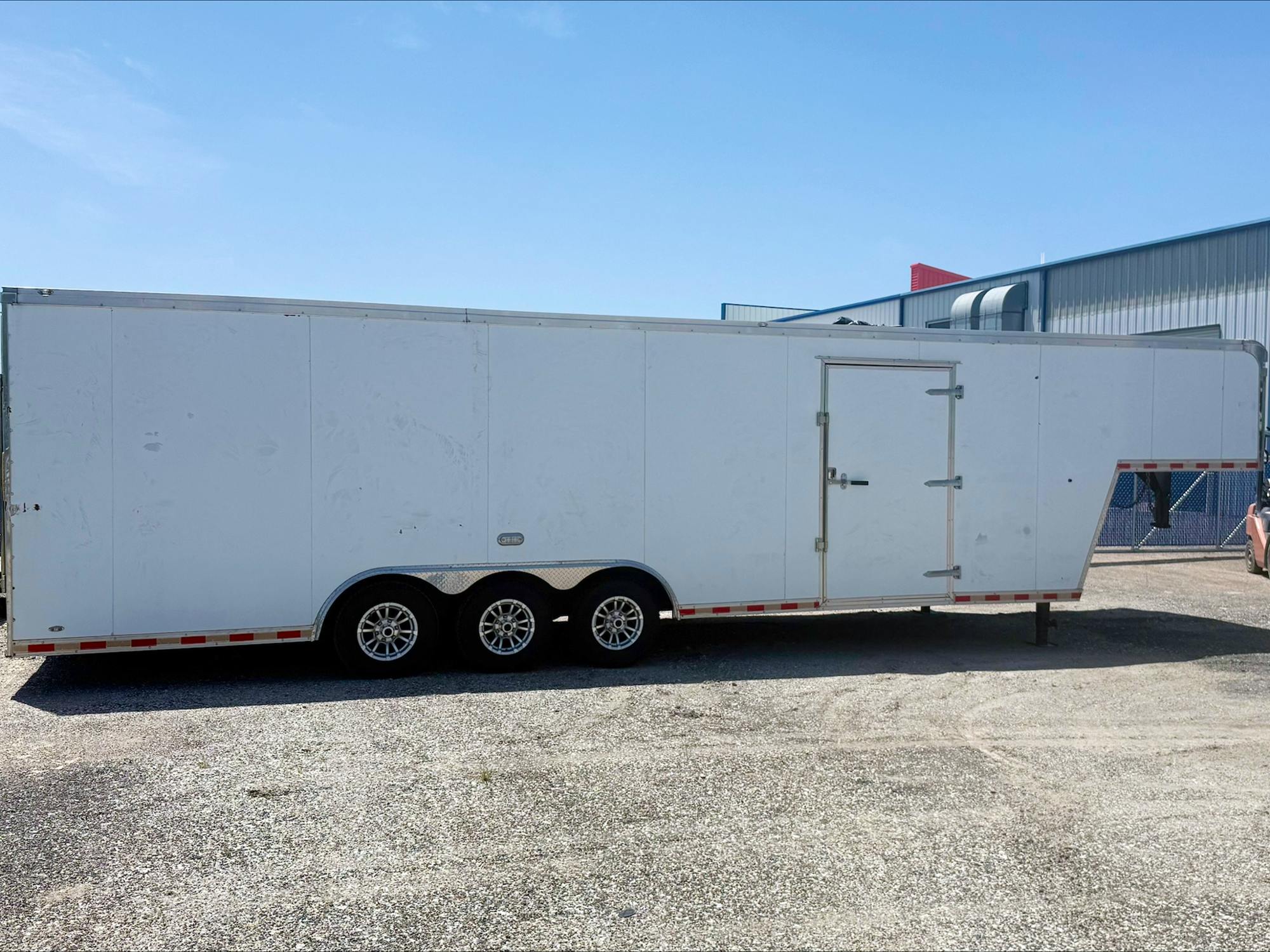 Cargo Mate USED 8.5'x34' Triple Axle Gooseneck Enclosed Cargo Trailer